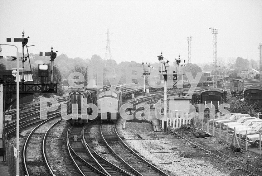 LPPC DSL BW 0984 
 Whilst an 08 350hp shunter forms an engineers train in the yard, a light English Electric Type 3 Class 37 comes off the Radyr loco stabling point and heads off up the valley. Behind the two locos, the line to the left runs directly to Cardiff Queen Street station whilst that to the right also goes to Cardiff, but it is freight only and, once there, becomes the avoiding line behind Canton depot, 86A, to give access to the Barry line or ahead towards Newport. 
 Keywords: BR, Radyr, Western, Wales, Coal, Freight, Class 08, Class 37, Shunter