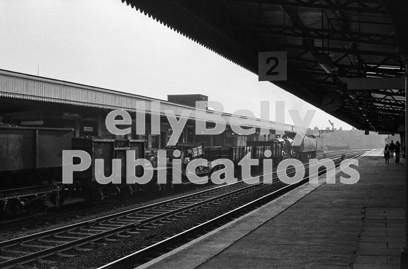 LPPC DSL BW 1146 
 A Brush Type 4 Class 47 heads a varied assortment of freight wagons south through Leamington Spa on one of its centre roads. The loaded bogie Lowmac in the make-up would suggest that it is to be shunted out at Fenny Compton for the Kineton Army Depot, which is also now used to store disused DMUs, EMUs and rolling-stock. Leamington Spa station itself has been restored to some of the art-deco glory originally designed by the GWR, in particular the up and down station buffets. 
 Keywords: BR, Western, Leamington Spa, Freight, Class 47, Lowmac