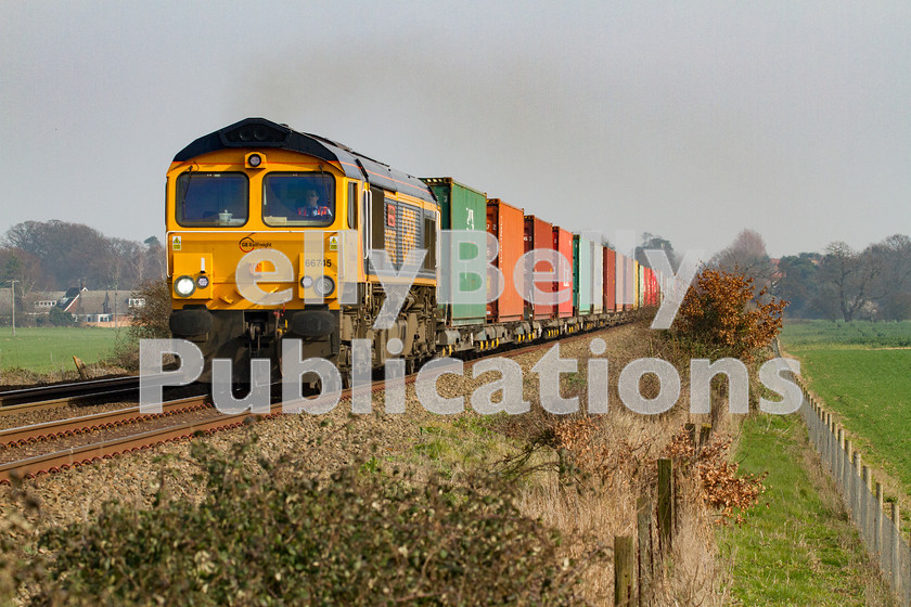 LPIS-D-DSL-CO-0009 
 GBRf Class 66 66745 approaches Heath Road foot crossing as it climbs away from Thurston towards Bury St. Edmunds with the 4E33 Felixstowe South to Doncaster container train on 13th March 2014. 
 Keywords: 66745, Class66, Colour, Container, Digital, East Anglia, Eastern, Freight, GBRf, Heath Road, Level Crossing, Rights Managed, Stock, Suffolk, Thurston