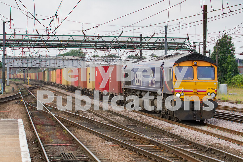 LPIS-D-DSL-CO-0043 
 GBRf Class 66, 66726, gathers pace through Doncaster station with 4D78 Peterborough to Selby container train on 20th June 2014. 
 Keywords: 66726, Class 66, Colour, Container, Digital, Doncaster, Eastern, Freight, GBRf, Rights Managed, Stock, Yorkshire