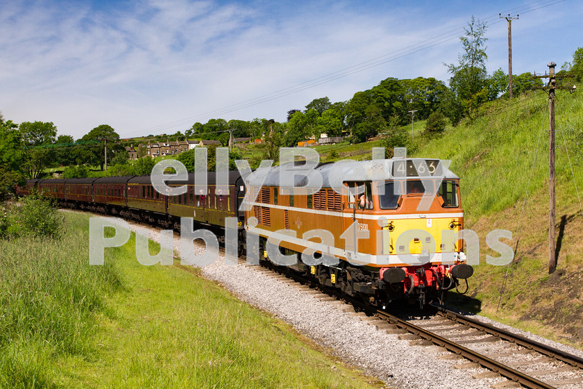 LPIS-D-DSL-CO-0025 
 Class 31 D5830 in it's ochre livery departs from Oakworth and heads north towards Keighley during the Keighley and Worth Valley Railway's Summer Diesel Gala on 6th June 2014. 
 Keywords: 31297, Class 31, D5830, Diesel, Digital, Gala, Haworth, Heritage, Keighley and Worth Valley Railway, LMS, Midland Region, Preserved, Rights Managed, Stock, Yorkshire