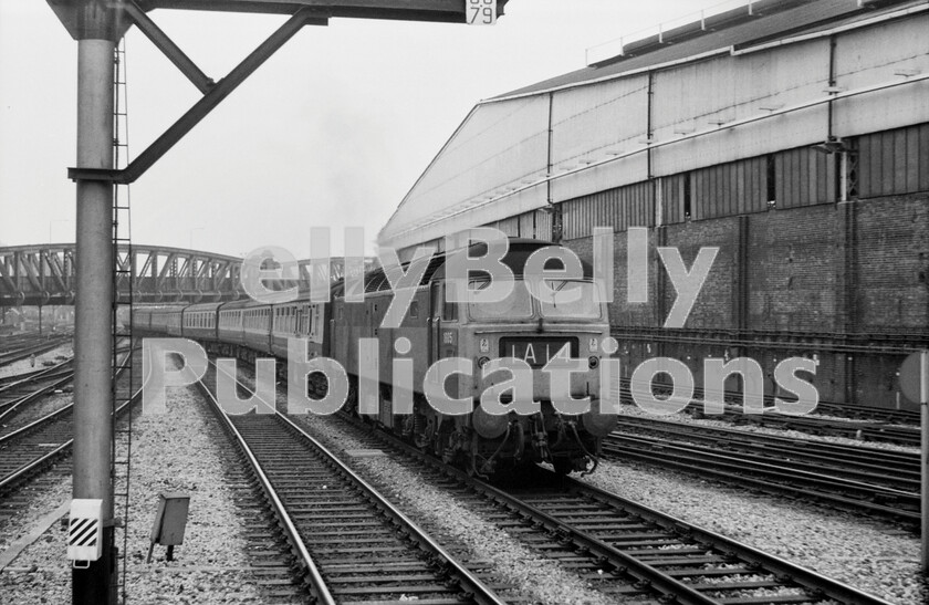 LPPC DSL BW 0288 
 Heading into Paddington to complete its run from Weston-super-Mare is a two-tone green Brush Type 4 Class 47 number 1605 (later 47028/47559) in 1971. On the right is the huge Paddington Goods Depot which has now long gone. The train is the 13.40pm service that was due to arrive in the capital at 16.10pm, and is formed of the then-standard air-braked rake of Mark 2 carriages with the addition of Mark 1 catering vehicles and a BG Full-Brake. The stock returned to Bristol at 19.45pm after being serviced at Old Oak Common carriage sheds. Beyond the familiar girder-bridge in the background will be London Transports Royal Oak station, their electrified tracks being the two on the far right in the picture. 
 Keywords: Class 47, 1605, 47028,47559, Paddington, Passenger, 1971