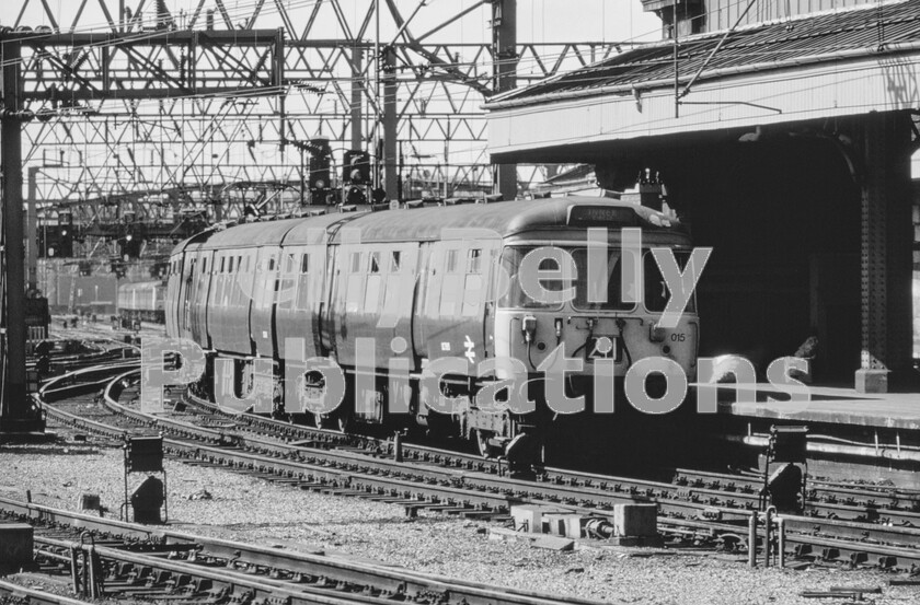 LPPC DSL CO 0001-Edit-Edit 
 Glasgow suburban electrification took place during 1959/1960, initially in the North Clyde area, with three-car units built by Pressed Steel at their Paisley plant, but serious transformer failures when less than a year old led to the complete class being withdrawn and replaced by steam services until the fault could be rectified. Once sorted they almost became icons of the Glasgow rail scene in their Caledonian blue livery. This is one of the classes leading an Inner Circle service into Glasgow Central in the early 1970s, as the Southern Clyde area had joined the electrified system in 1967, a few new identical units being built for the services. The original batch of trains became Class 303 whilst the identical second batch, built by Cravens in Sheffield became Class 311. 
 Keywords: Digital, Rights Managed, Stock