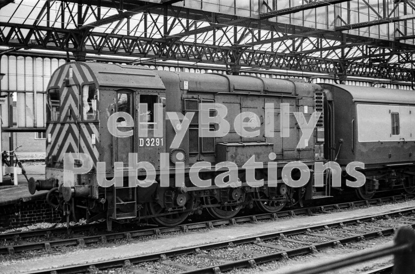 LPPC DSL BW 0432 
 It is remarkable how some locos slipped through the netting and missed being repainted for many years. Idling away a few minutes in one of the many short, almost hidden, bay platforms at Crewe is a 350hp BR-built Class 08 shunter still in virtually original condition in 1973, in green livery with the 1950s British Railways lion and wheel insignia so it has even missed out on receiving its BR Heraldic device. and its original number D3291. The wasp striped cab-ends are more modern additions however. It finally became rail-blue in January 1974 and was renumbered 08221 on being transferred to Bletchley. 
 Keywords: Digital, Rights Managed, Stock