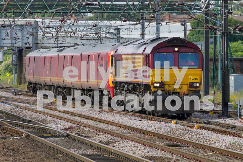 LPIS-D-DSL-CO-0038 
 DB Schenker Class 66, 66132, approaches Doncaster with the heavily delayed 1E06 parcels from Willesden to Low Fell on 20th June 2014. The Class 325 unit, 325008, had failed earlier in the journey and the train was running nearly 7 hours late. 
 Keywords: 325008, 66132, Class 325 Colour, Class 66, DB Schenker, Digital, Doncaster, EWS, Eastern, Failed, Passenger, Rights Managed, Stock, Yorkshire