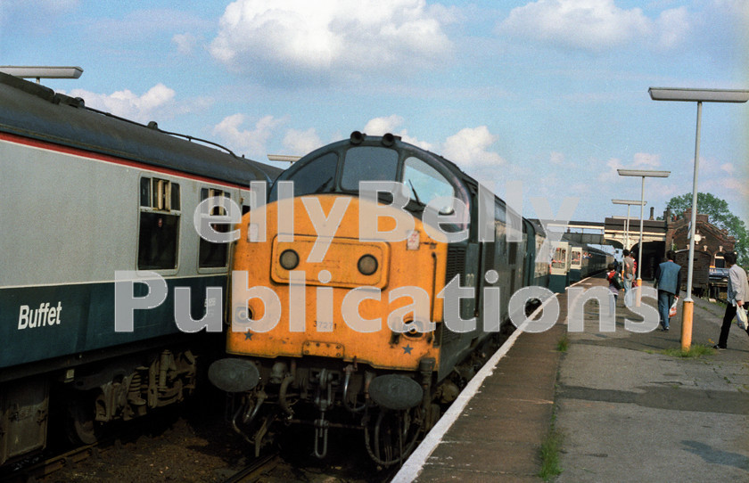 LPAP-DSL-CO-0062 
 Awaiting time at March, Cardiff's 37271 heads the Yarmouth - Manchester Saturday's only service, 16th June 1984. 
 Keywords: BR, Eastern, LNER, Norfolk, Great Yarmouth, Diesel, BR, Passenger, Colour, Class37, 37271, D6971, LE, 1984