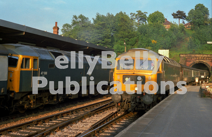 LPAP-DSL-CO-0060 
 Mainline services pass at Ipswich, 47588 heading to London, as 47573 slows with a Norwich train, 13th June 1984. 
 Keywords: BR, Eastern, LNER, Suffolk, Ipswich, Diesel, BR, Passenger, Colour, Class47, 47588, D1773, BS, 47573, D1768, TI, 1984