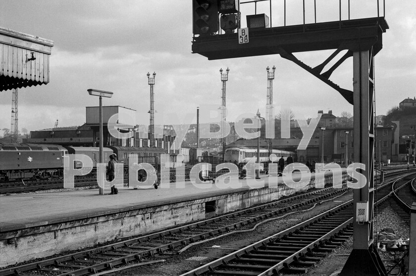 LPPC DSL BW 0706 
 Spotters are enjoying the almost continuous movements that took place in the area around Bristols Bath Road depot and Temple Meads station. A Brush Type 4 Class 47 1753 (later 47491/47769) is stabled next to a CCT van and a Collett coach. Half inside one of the Bath Road maintenance sheds is one of the Bristol Pullman diesel-hydraulic units. Originally known as the Blue Pullmans because of their bright livery, these trains suffered a similar fate to other Pullmans being painted in drab, corporate blue and grey, but curiously reversed, presumably to convey exclusivity, before withdrawal. The Class 47 is still with us, being owned by the Harry Needle Railroad Company and stored at Barrow Hill in Derbyshire. 
 Keywords: BR, Bristol, Western, Class 47, British Pullman, Bristol Bath Road, Shed, Depot, 1753, 47491, 47769