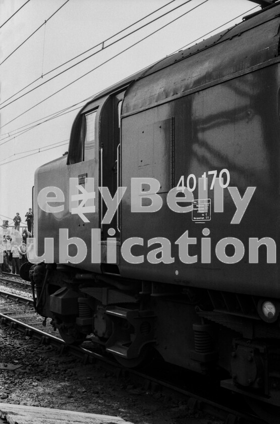 LPPC DSL BW 05270529 
 The participants of a North West tour that included many non-passenger lines, have gathered to photograph the Class 40 locomotive and are quite happy to crowd in an area that would probably have todays rail authorities apoplectic. The very clean English Electric Type 4 Class 40 40170 is ringing away to itself in appreciation.

The date was 29/4/78 and it was heading the North West Rambler, as seen on the previous page, which had travelled from London to Crewe Basford Hall hauled by a rare example of Class 84 electric, in fact the doyen, number 84001. Haulage from there to Liverpool Lime Street was Class 40 number 40185 then 40170 back to Crewe via ex-CLC lines around Manchester. This photo-stop was at Ashburys station.