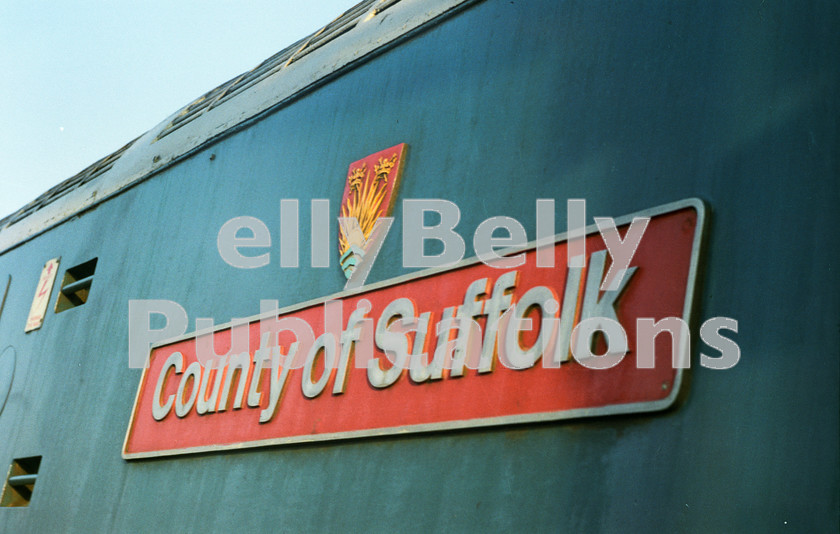 LPAP-DSL-CO-0003 
 A sunny view of 'County of Suffolk's nameplate and crest, which adorned 47584. 
 Keywords: BR, Eastern, LNER, Diesel, BR, Passenger, Colour, Class47, 47584, D1775, TI, 1982