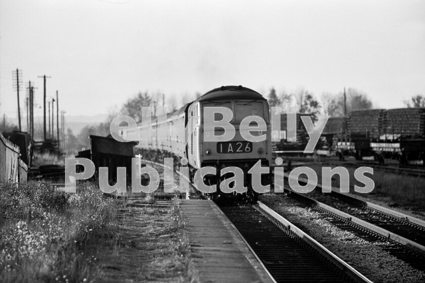 LPPC DSL BW 0929 
 You can almost feel the thrumming of its Maybach engine as a Hymek Type 3 Class 35 charges through the then-closed Honeybourne station ready to attack the climb to Chipping Campden tunnel. The train is the 14.15pm 1A26 from Worcester to London Paddington and was photographed in late 1971. On the right are the Engineers Sidings known as Honeybourne Tip and the train is about to pass over the GW Stratford-upon-Avon to Cheltenham line. 
 Keywords: BR, Western, Hymek, Class 35, 1A26, Honeybourne, Passenger