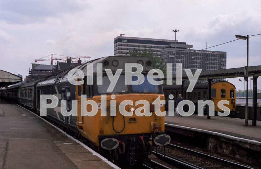 LPAP-DSL-CO-0048 
 Departing Basingstoke with a Waterloo - Exeter is 50038, 12th May. 1984. 
 Keywords: BR, Southern, Southern, Hampshire, Basingstoke, Diesel, BR, Passenger, Colour, Class50, 50038, D438, BR, 1984