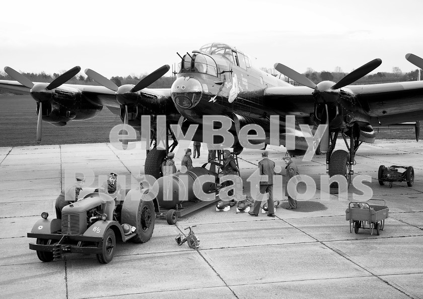 IMG 1134-1-copy 
 A re-enactment at East Kirkby Airfield of loading up Avro Lancaster NX611 'Just Jane' with a variety of bombs. March 17th 2012. 
 Keywords: Digital, ISO, John Stiles