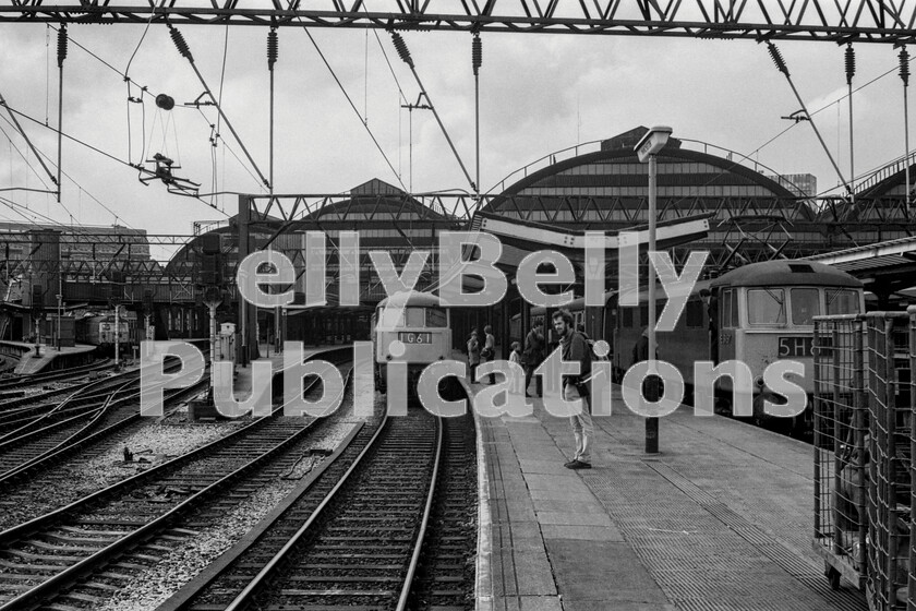 LPPC DSL BW 0434 
 A platform-end view of Manchester Piccadilly in 1973 with an original series AL electric loco heading 1G6116.24 Manchester to Coventry service via Crewe and Wolverhampton in the middle, whilst an AL6 Class 86 readies itself at the adjacent platform with the ECS move to Lonsight carriage sidings with the stock of 1M68 10.15 Paignton to Manchester service. On the left, in the background, a Western Lines suburban Class 304 EMU is calling at Piccadilly having come from Manchester Oxford Road. On the immediate right are a couple of BRUTEs (British Rail Universal Trolley Equipment) for parcels traffic and part of the period modernisation plan. Neither the traffic, nor the BRUTES survived privatisation. 
 Keywords: Digital, Rights Managed, Stock