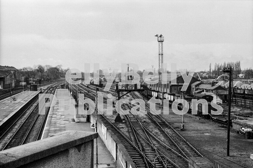 LPPC DSL BW 0392 
 It is salutary to think that there was a yard of this size at the London-entry area of virtually every main-line railway into the metropolis at one time. Built to sort the tens of thousands of braked and unbraked wagons that arrived 24 hours a day from every corner of the UK it was, perhaps, not surprising that BR wanted rid of the whole tradition. This shot, of Acton Yard, was taken mid-morning when all the overnight services had arrived and the onward services had left. A rare quiet moment with only a Class 08 playing with trucks as the Rev Awdry would have said, in the middle-distance. On the far right can be glimpsed the beginnings of the stone-traffic terminal which now dominates the scene. 
 Keywords: BR, Western, Acton, Marshalling Yard, Class 08