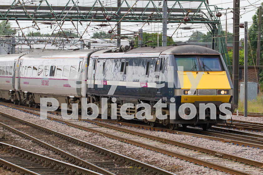 LPIS-D-DSL-CO-0042 
 Still with its GNER livery, East Coast Trains Class 91, 91118, approaches Doncaster station on 20th June 2014, with 1D03 from London King's Cross to Leeds. 
 Keywords: 1D03, 91118, Class 91, Colour, Digital, Doncaster, East Coast Trains, Eastern, GNER, Passenger, Rights Managed, Stock, Yorkshire