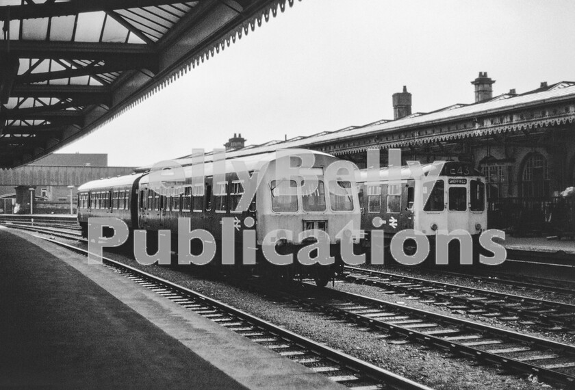 LPPC DSL CO 0007-Edit 
 A dismal summers day at Sheffield does nothing to highlight the almost depressing sight of a Metropolitan Cammell Class 101 stabled on a centre road between services and a Class 110 Birmingham Railway Carriage and Wagon three-car set that has just arrived as a terminating train from Manchester via the Hope Valley. There is irony in this in that these particular DMUs were built especially for and with great fanfare, the Calder Valley route and to help with the gradients on that line they were fitted with 238hp Rolls Royce engines. By this time in the early 1970s, they had become just common-user units in the Pennine area. 
 Keywords: Digital, Rights Managed, Stock