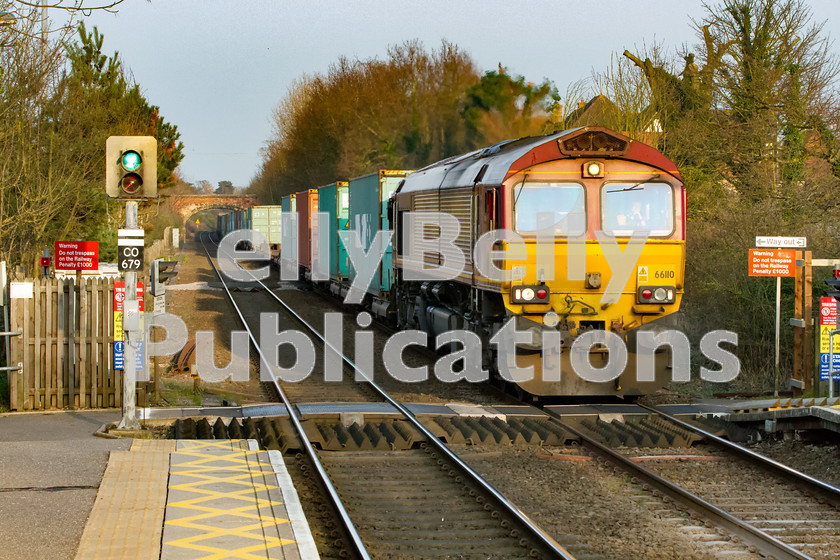 LPIS-D-DSL-CO-0016 
 DB Schenker Class 66, 66110, heads 4E45 through Thurston station as it makes it way through East Anglia towards Wakefield Europort from Felixstowe. 
 Keywords: 66110, Class66, Colour, Container, DB Schenker, Digital, EWS, East Anglia, Eastern, Freight, Rights Managed, Safety, Stock, Suffolk, Thurston