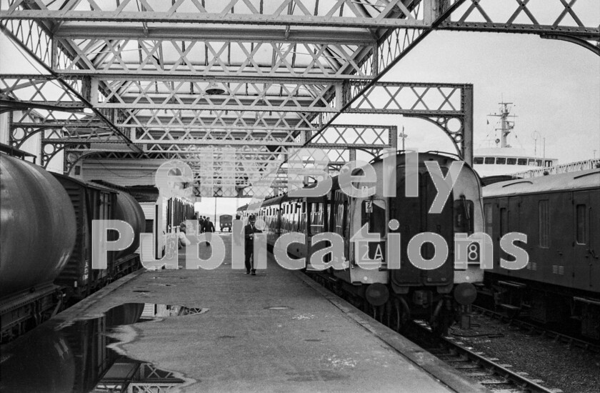 LPPC DSL BW 1223 
 An overnight trip from Carlisle on an almost deserted short train of assorted coaches and vans to Ayr meant we were in time to catch one of the original BR Swindon Works-built Inter City units of the late 1950s to that outpost of south-western Scottish rail terminals at Stranraer. Consisting of just one 126 Class unit, our first-class compartment was difficult to tell the difference from a loco-hauled coach interior of the period, with much woodwork in evidence. It was propitious that the unit was turning round almost immediately at its terminus and heading back to Glasgow as it turned out that there was precious little to see when we got there and with the withdrawal of the ferry service to Larne from this point there must now be even less. So, after a leg-stretch on the platform and the shot you see here safely recorded, we were on our way back in less than 30 minutes. 
 Keywords: Digital, ISO, John Stiles