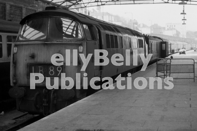 LPPC DSL BW 0485 
 Early morning at Penzance in September 1974 as Western Class 52 D1050 Western Ruler waits patiently at the buffer-stops having arrived at the head of the previous nights sleeper train from Paddington. Note the GUV at the head of the formation to carry the mornings newspapers and the wall in the left background over which generations of spotters have noted the trains and locomotives coming and going from the station. Penzance is situated 299 miles from Paddington, exactly the same distance as Euston to Carlisle, but with totally different topography. 
 Keywords: BR, Western, Class 52, D1050, 'Western Ruler', 1B89, Penzance, Passenger, Sleeper, 1974