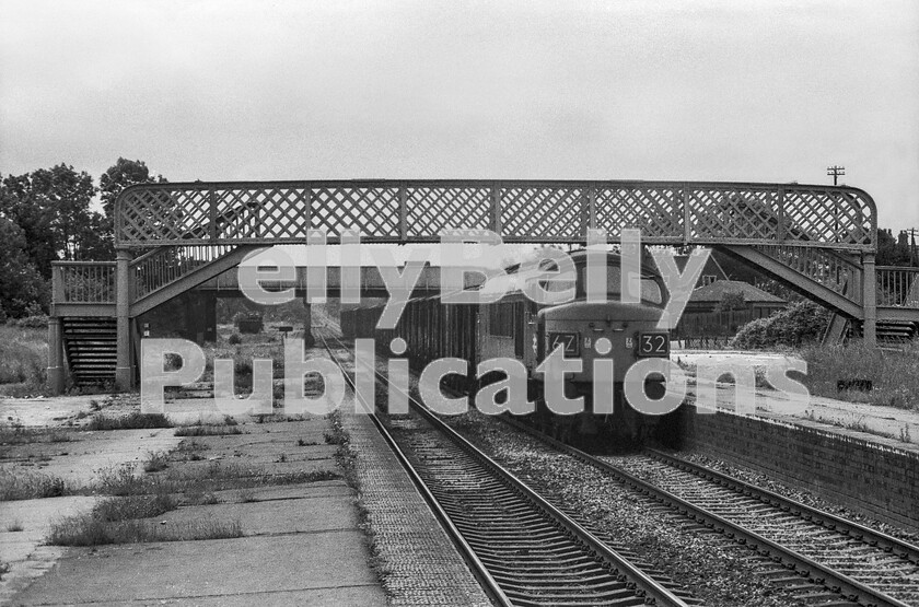 LPPC DSL BW 1126 
 A special freight, probably conveying perishable traffic from Devon and Cornwall, heads north through Ashchurch behind a Peak Class 45. A new station was built on the site in 1997 enabling it to reopen (on 1st June), but without any of its original branch lines diverging. It is named Ashchurch for Tewkesbury. 
 Keywords: BR, Ashchurch, Class 45, Freight, Peak