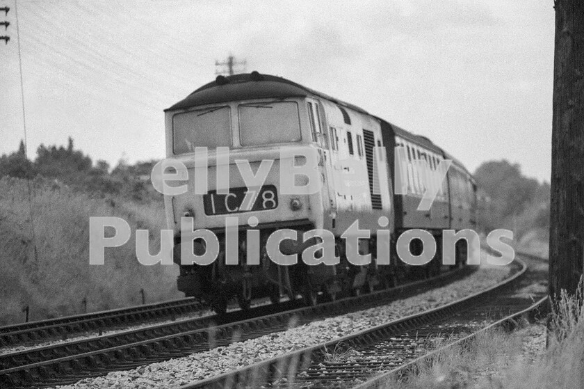 LPPC DSL BW 1298 
 Slowing for the single-line junction before heading through Colwall Tunnel under the Malvern Hills, is a Hymek Type 3 Class 35 on the Hereford portion of an express from London, which would have been detached from the main train at Worcester Shrub Hill. It is believed that on this stretch of line, from the top of the Malvern Hills, the sight and sound of what was possibly a Saint, or a City, on much the same train as depicted, was enough to inspire Edward Elgar to write the Pomp and Circumstance marches. 
 Keywords: BR, Hymek, 1C78, Western, Passenger, Class 35, Colwall Tunnel, Malvern