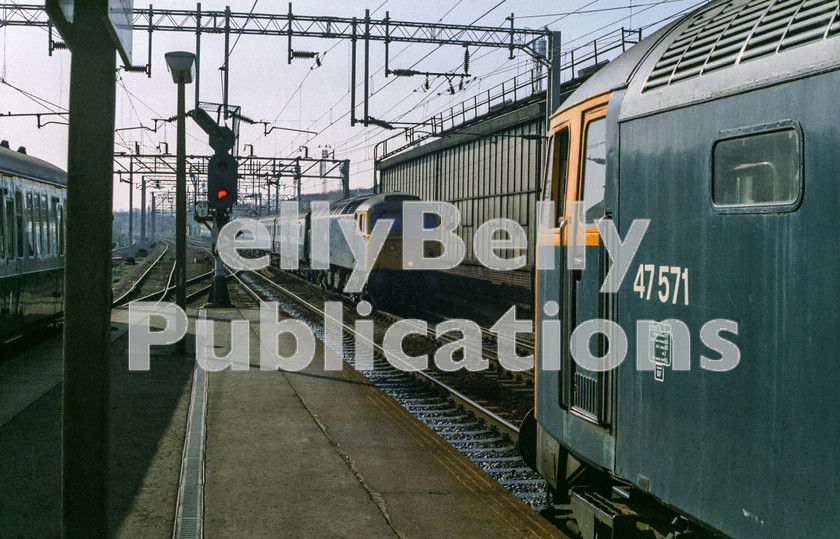 LPAP-DSL-CO-0042 
 Whilst working between Norwich and the capital, 47571 on an up working is passed by 47487 on a down working, 25th April 1984. 
 Keywords: BR, Eastern, LNER, Essex, Colchester, Diesel, BR, Passenger, Colour, Class47, 47571, D1758, SF, 47487, D1707, CD, 1984