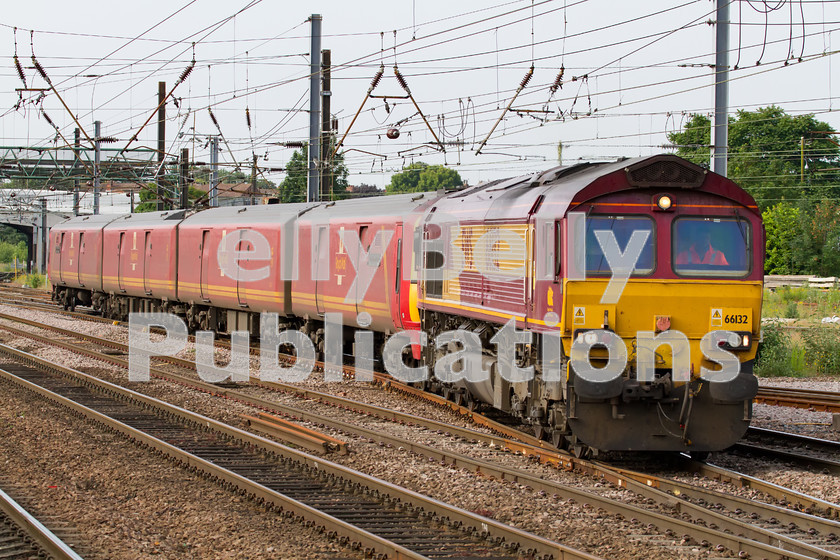 LPIS-D-DSL-CO-0039 
 DB Schenker Class 66, 66132, approaches Doncaster with the heavily delayed 1E06 parcels from Willesden to Low Fell on 20th June 2014. The Class 325 unit, 325008, had failed earlier in the journey and the train was running nearly 7 hours late. 
 Keywords: 325008, 66132, Class 325 Colour, Class 66, DB Schenker, Digital, Doncaster, EWS, Eastern, Failed, Passenger, Rights Managed, Stock, Yorkshire