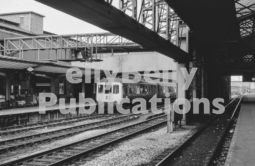 LPPC DSL CO 0176-Edit 
 The BR Modernisation plan as set out in 1955 foresaw the complete withdrawal of steam power to be replaced by diesels and strategically situated electrification. It was a coherent and extremely comprehensive plan except for the approach to dieselisation which was basically scattergun in that it involved the ordering of new equipment from many different suppliers assuming at least one would be the right choice. Not only was this costly but difficult to control leading to many different types of train and locomotive being built, often without success. DMUs were not immune and whilst this Class 100 built by the Gloucester Carriage and Wagon Co lived a long life and one is here waiting at Chester with a stopping train to Manchester Piccadilly, there were very few of them, amongst the more common BR/Derby units, which required more spare parts than necessary and different skills to maintain them. 
 Keywords: Digital, Rights Managed, Stock