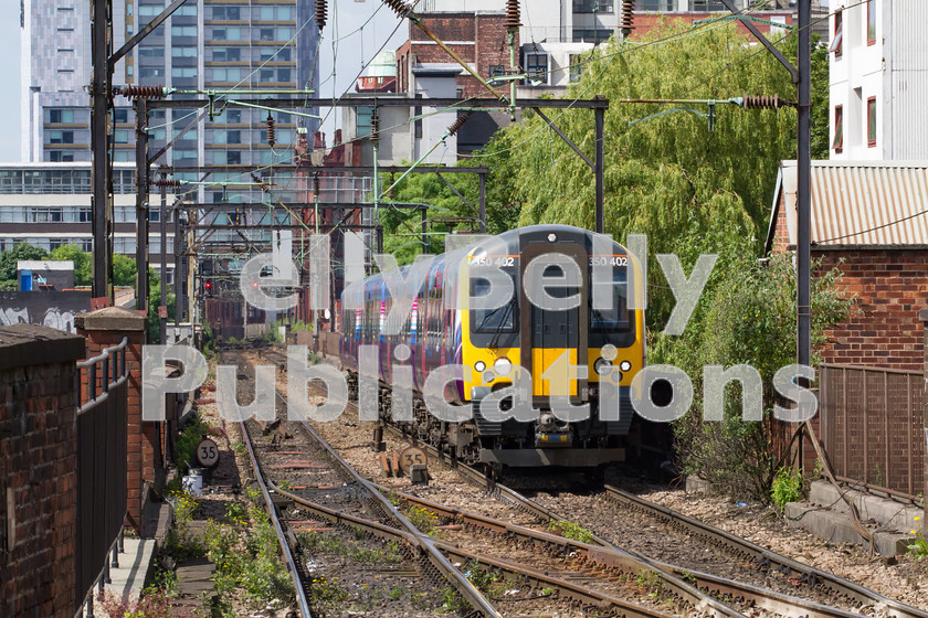 LPIS-D-DSL-CO-0030 
 First Transpennine Express Class 350 Desiro, 350 402, approaches Manchester Piccadily station with 1M93 from Edinburgh to Manchester Airport on 12th June 2014. 
 Keywords: 350 402, Class 350, Colour, Desiro, Digital, First Transpennine Express, Greater Manchester, Manchester Piccadily, Midland, Passenger, Rights Managed, Stock