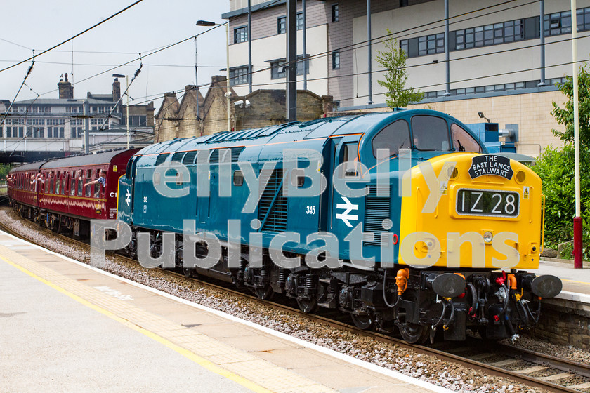 LPIS D DSL CO 0023 
 Class 40 Preservation Society's 40 145, masquerading as 345 powers it's first mainline railtour in over 3 years through Keighley on its way to Bury on Day 1 of 'The East Lancs Stalwart' train on 6th June 2014. 
 Keywords: 2014, 40 145, BR, CFPS, Class 40, D345, Diesel, Digital, EE, Keighley, LMS, Midland, Passenger, Rights Managed, Stock, Yorkshire, railtour