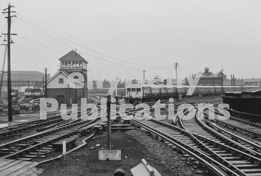 LPPC DSL CO 00010013-Edit 
 An end of platform view at Southport, on a particularly unpleasant day in the 1970s. As can be seen, two routes split away from each other immediately beyond the end of the platforms and the Class 503 emus stabled in the centre are adjacent to the Wirral and Southport coast lines of the Liverpool electric Mersey suburban system. To the right then is the line to Liverpool, next stop Birkdale for the famous Royal Birkdale Golf Course and to the left the line leads sharply round to Meols Cop, Burscough and Wigan. 
 Keywords: Digital, Rights Managed, Stock