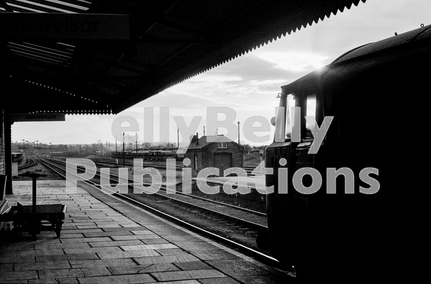 LPPC DSL BW 0621 
 At Westbury station on the WRs Berks and Hants line, Hymek Type 3 Class 35 D7009 thrums away to itself having just arrived with the 15.42pm ex Bristol on a Saturday afternoon in 1972. Stabled in the right background, awaiting the resumption of freight services on Monday morning are several Brush Type 4 Class 47s with extensive yards on both sides of the running lines. The line to Salisbury curves away to the left in the far background, whilst ahead takes trains to the main Berks and Hants cut-off line heading west. Despite the title of the line, it never actually goes into Hampshire at all, being an early 20th century GWR marketing mans idea of a romantic name. 
 Keywords: BR, Hymek, D7009, Westbury, Passenger, Class 47, Class 35