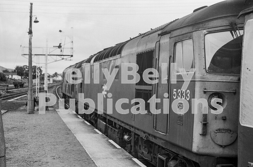 LPPC DSL BW 00729 
 Aviemore The first down morning train, after the departure of the Royal Highlander, from Perth to Inverness waits time at Aviemore before heading north over Slochd Summit to its final destination. Double-heading with two Sulzer Type 2s was the normal booked motive-power for these trains and it was quite common to see different Classes in multiple. Here a BR-built Class 25 is heading a BRCW Class 26 number 5333. 
 Keywords: Digital, Rights Managed, Stock