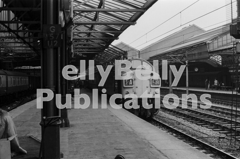 LPPC DSL BW 1241 
 The passengers on the previous page need wait no longer as their train has come to a stand in the platform at Crewe. According to the station clock this train, 1A58, the 1355 Saturdays only from Barrow-in-Furness to London Euston has taken about three hours to reach this point where the English Electric Type 4 Class 40, number 342, later 40142 is about to be replaced by an electric loco which will dash up to London at noticeably higher speeds for the passengers. 
 Keywords: Digital, ISO, John Stiles