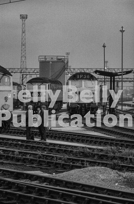 LPPC DSL CO 0104-Edit-Edit 
 Conversation piece, as the loco inspector or foreman with the briefcase is brought up to date with the latest news. An unidentified Class 50 sits at the fuelling point of Crewe Diesel Depot situated at the south end of Crewe station. It is ready to take over the 17.05 Euston to Barrow-in-Furness (1P36) from an electric during the North West electrification work. 
 Keywords: Digital, Rights Managed, Stock