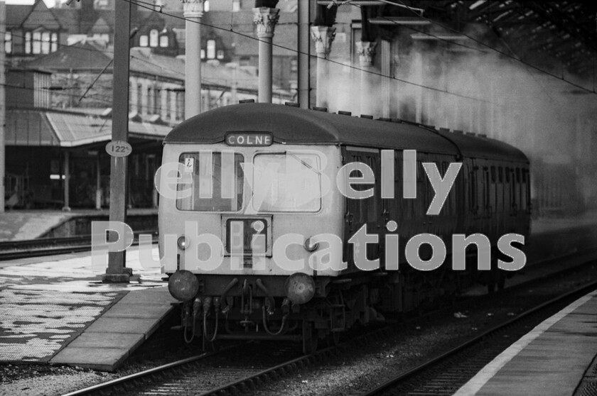 LPPC DSL BW 0951 
 One of the powerful Cravens-built 2-car DMUs of Class 105, which boasted both cars being powered to deal with Pennine gradients, heads away south from Preston station, trailing exhaust smoke, with a train for Colne which was, by this time, the terminus of a line which originally ran through to Skipton. It was reached via Blackburn, Accrington and Rose Grove the latter being the famous steam MPD that lasted until the very end of that era. 
 Keywords: Digital, Rights Managed, Stock