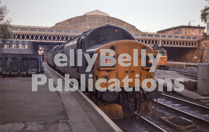 LPAP-DSL-CO-0130 
 With 97251 'ETHEL 2', 37037 prepares to leave Glasgow Queen St with the 0550 to Fort William, 28th May 1985. 
 Keywords: BR, Midland, LMS, Scotland, Glasgow, Diesel, BR, Passenger, Colour, Class37, 37037, D6737, ETHEL2, 97251, ED, MR, 1985