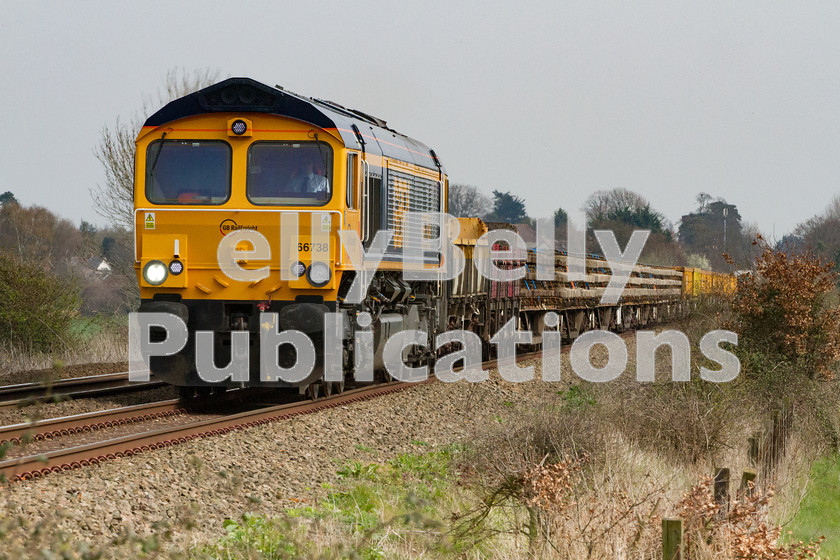 LPIS-D-DSL-CO-0017 
 GBRf Class 66, 66738, heads an Engineer's train from Harwich to Peterborough past on Sunday 30th March 2014. The train is approaching Heath Road foot Crossing just east of Thurston station as it climbs towards Bury St. Edmunds. 
 Keywords: 66738, Class66, Colour, Digital, East Anglia, Eastern, Engineer, Freight, GBRf, Heath Road, Level Crossing, Rights Managed, Stock, Suffolk, Thurston