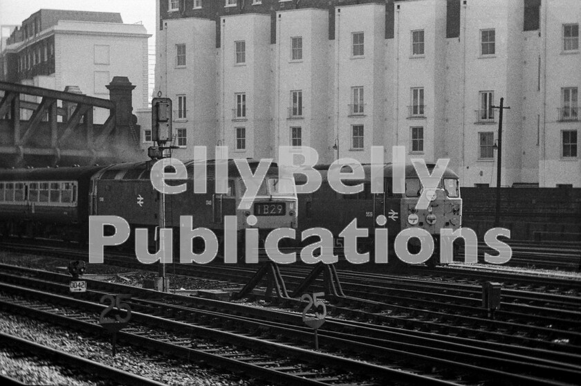 LPPC DSL BW 0313 
 Class 47 1749 (later 47156), departs London Paddington with the 12.52pm 1B29 service to Cheltenham in 1971. Alongside is Class 31 5539 (later 31121), used regularly at this time to move coaching stock between Paddington station and Old Oak Common carriage sidings. The leading coach of the Cheltenham service has one of the short-lived waist-level destination boards that were used at this time. To the right and adjacent to 5539 are the points at the throat of the entrance to the locomotive layover sidings at Westbourne Park. These were used by engines that were booked for a smart turn-round in London and wouldnt have time to return to Old Oak between arrival and departure. 
 Keywords: BR, Western, Paddington, Class 47, Class 31, 1749, 47156, 5539, 31121, 1971