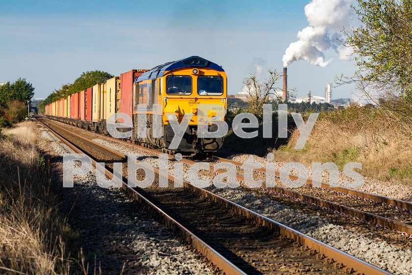 LPIS-D-DSL-CO-0003 
 GBRf Class 66, 66730 approaches Catteshall level crossing as it climbs away from Bury St. Edmunds heading towards Ipswich with the late running 4L02 Hams Hall to Felixstowe container train on 30th October 2013. 
 Keywords: 66730, Bury St. Edmunds, Catteshall, Class66, Colour, Container, Digital, East Anglia, Eastern, Freight, GBRf, Rights Managed, Stock, Suffolk