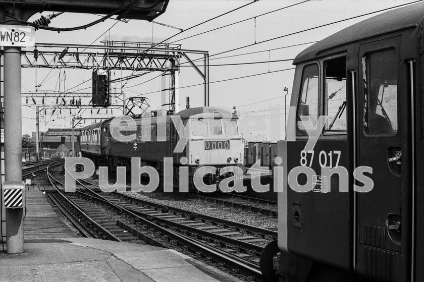 LPPC DSL BW 0886 
 The north end of Wolverhampton station  once High Level - witnesses the meeting of two AC electric powered services and in the foreground, having terminated from London, is Class 87 number 87017. This class was built, in 1973/4, specifically for WCML services after the inauguration of overhead electric wiring throughout London to Glasgow. With 5000hp they had the capacity to single head Inter City expresses that had previously required two Class 50 diesels. This loco was later named Iron Duke and eventually was sold to Bulgaria in 2009. Approaching is an AL6 Class 86 3300hp engine (86214) heading what is probably a through train from Manchester to the West Country or South Wales via Birmingham New Street. It is rounding the tight curve having travelled from Stafford. The route to the left ahead leads to Shrewsbury. 
 Keywords: Digital, Rights Managed, Stock