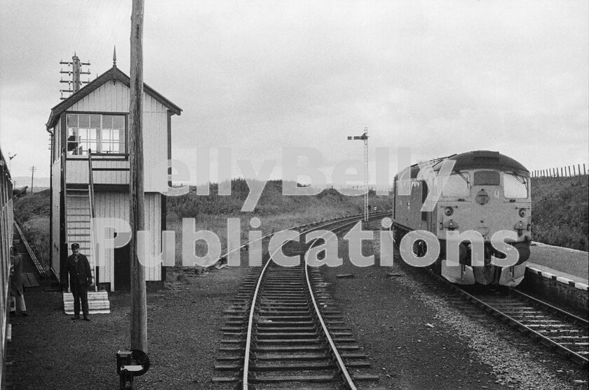 LPPC DSL BW 0915-Edit 
 The journey from Inverness to the Far North consists of long moments of fairly tedious single-track interspersed with interesting stations and passing loops and some beautiful scenery but once past Altnabreac the land becomes flat and almost featureless until, seemingly out of the blue, the signalbox and junction at Georgemas arrive with a Sulzer Type 2 Class 27 ticking over in that desultory way that these locos did. The form was that the train drew forward into the station allowing the branch loco to come on the back and head our two uncoupled coaches off around the line to the right on which the Class 27 is standing in this picture. 
 Keywords: Digital, Rights Managed, Stock