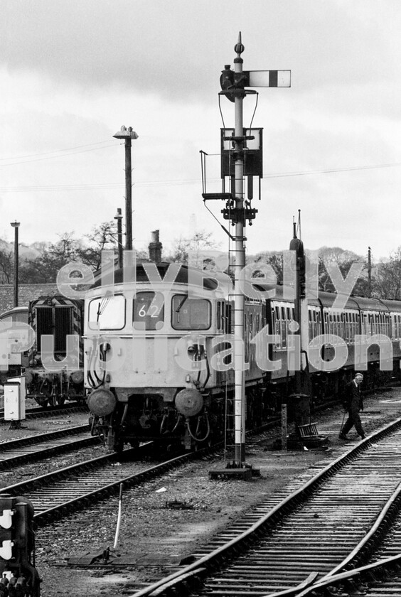 LPPC DSL BW 0701 
 A Crompton Type 3 Class 33, having arrived at Exeter from Waterloo, has stabled its train of Mark 1 coaches in the sidings for servicing before its return journey. The SR loco makes a fine juxtaposition with the GW drop-arm semaphore signal and all the railway furniture, clutter and Victoriana such as the steam-age water-crane.

A regional boundary change took place in 1967 and west of Salisbury the SR lost its line to Exeter to the WR. From pathetic beginnings of three-car suburban DMUs with no toilets replacing some Pacific-hauled passenger trains on the route, the service became one of the most varied on BR over time. Class 42/3 Warships powered most services for many years, before giving way to Crompton Class 33s as in the picture, although the stock was supplied by the WR. Later, these trains enjoyed Class 50 haulage under the umbrella of Network South East, before inevitably succumbing to DMUs in the shape of Class 158/9s. 
 Keywords: BR, Western, Class 33, Class 08, Class 45, Exeter St Davids, Shed, ECS, Coaching Stock