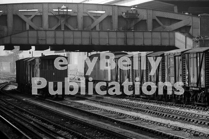 LPPC DSL BW 0312 
 It is difficult to believe that well into the rail-blue era, the huge Paddington Goods Depot was still despatching trains to the west. Here, in the mid-1970s, a Class 47 Brush Type 4 D1637 (later 47483) makes up its train of fitted vans in the yard adjacent to Royal Oak underground station on the Hammersmith branch. Nowadays the location is part of the Crossrail project, an area of which was also once utilised as a bus depot. After closure to rail services the vast goods shed became a National Carriers Limited road depot before it was finally earmarked for redevelopment and demolished in 1986. 
 Keywords: BR, Paddington, Western, Class 47, Parcels, Freight, D1637, 47483, Royal Oak