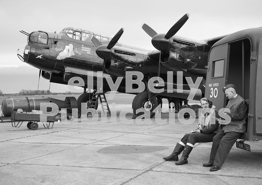 IMG 1171-1-copy 
 A re-enactment at East Kirkby Airfield of loading up Avro Lancaster NX611 'Just Jane' with a variety of bombs. March 17th 2012. 
 Keywords: 2012, Avro Lancaster, Black and White, Digital, East Kirkby, ISO, John Stiles, NX611, Re-enactment, United Kingdom