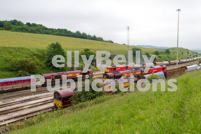 LPIS-D-DSL-CO-0037 
 A busy day at Peak Forest in Derbyshire, with a collection of Db Schenker Class 60 and Class 66 locomotives stabled or shunting trains on 18th June 2014. 
 Keywords: Class 60, Class 66, DB Schenker, Derbyshire, Digital, EWS, Freight, Limestone, Peak Forest, Rights Managed, Stock