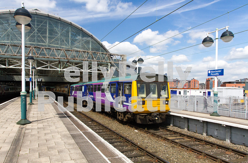 LPIS-D-DSL-CO-0032 
 Class 142 Pacer, 142 043, departs from Manchester Piccadily with 2H52, the 12:05 to Rose Hill and Marple on 12th June 2014. 
 Keywords: 142 043, Class 142, Colour, Digital, Greater Manchester, Manchester Piccadily, Midland, Northern Trains, Pacer, Passenger, Rights Managed, Stock