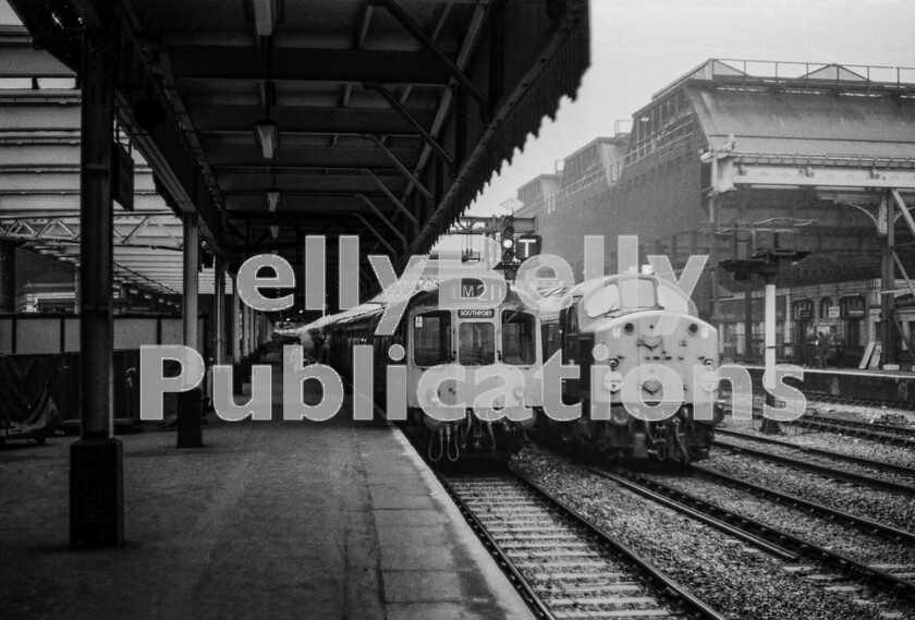 LPPC DSL BW 0673 
 The glory days of Manchester Victoria/Exchange stations on a miserably damp morning. The stations were interconnected and rather like a Victorian labyrinth and they included the longest railway platform in the UK which ran through their whole length. It was capable of accommodating two full-length trains by means of a centrally placed crossover, located behind the distant screens. The DMU destined for Southport is one of those units newly-built in the early 1960s specifically to provide a modernised service to the Calder Valley line to Leeds and were more powerful than their siblings to cope with the gradients as well as being provided with more comfortable interiors. But this is the early 1970s and budgets dictated that they had all become just common-user by this time. The English Electric Type 4 Class 40 318 (later 40118), the noise of which always sounded more like ringing then whistling as in the same companys Hastings DEMUs, has just been given the road on the westbound through line. The atmosphere of this huge century-old edifice needed to be experienced to be appreciated.