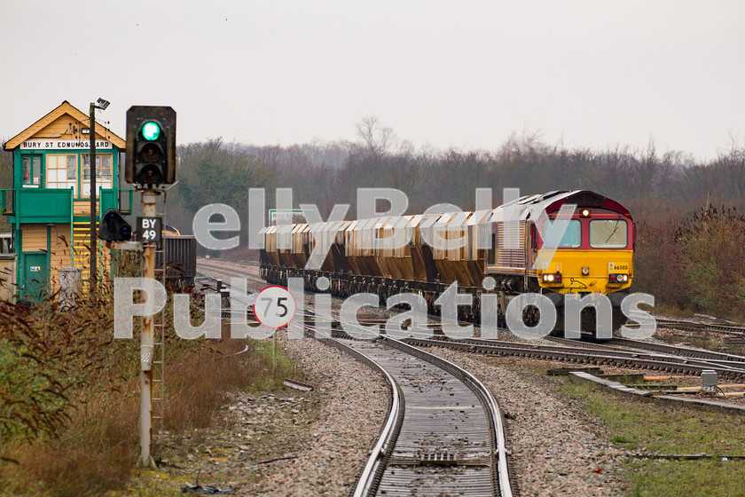 LPIS-D-DSL-CO-0005 
 EWS/DB Schenker Class 66, 66088, passes through Bury St. Edmunds station heading towards Barham with the 6L41 Mountsorrel to Barham mineral train on 7th February 2014. 
 Keywords: 66088, Bury St. Edmunds, Class66, Colour, DB Schenker, Digital, EWS, East Anglia, Eastern, Freight, Minerals, Rights Managed, Stock, Suffolk